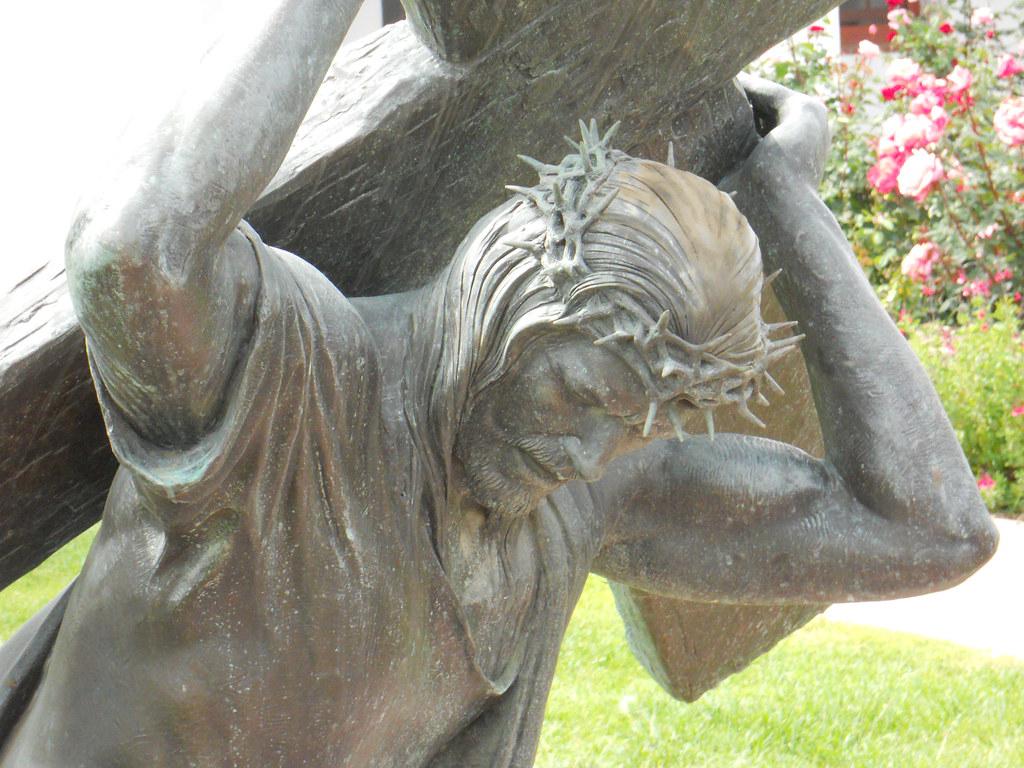 A visual representation of Christ taking on humanity's burdens